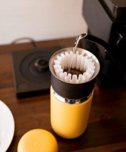 yellow carter mug in use
