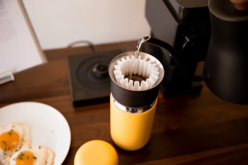 yellow carter mug in use