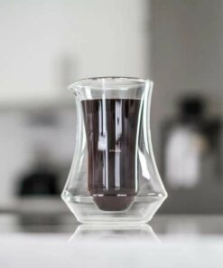 kruve pique pitcher on table