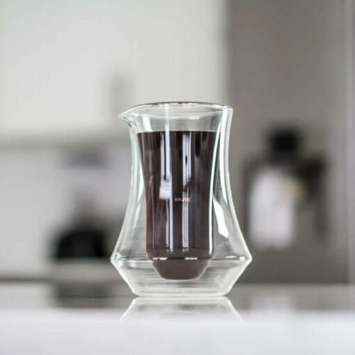 kruve pique pitcher on table