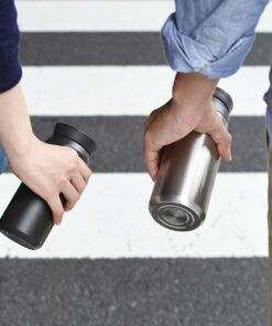 kinto travel cups in hand