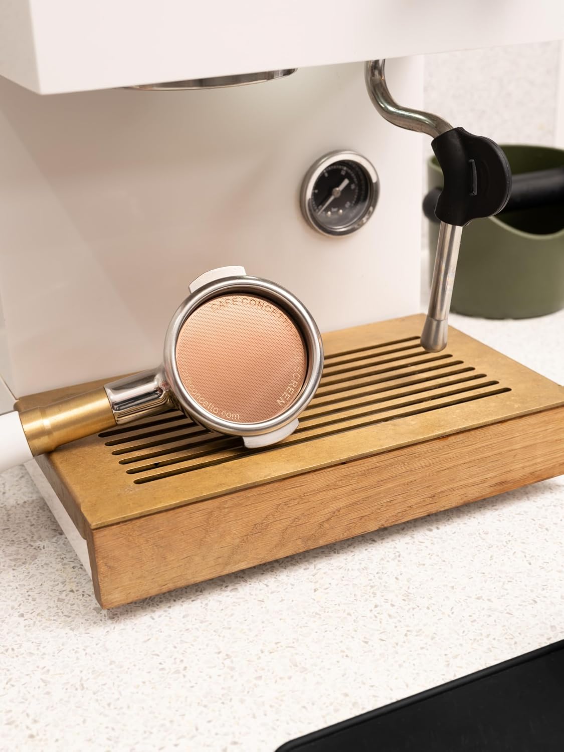 Portafilter with Cafe Concetto Puck Screen at the espresso machine