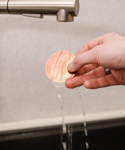 Rinsing the Cafe Concetto Puck Screen under the tap