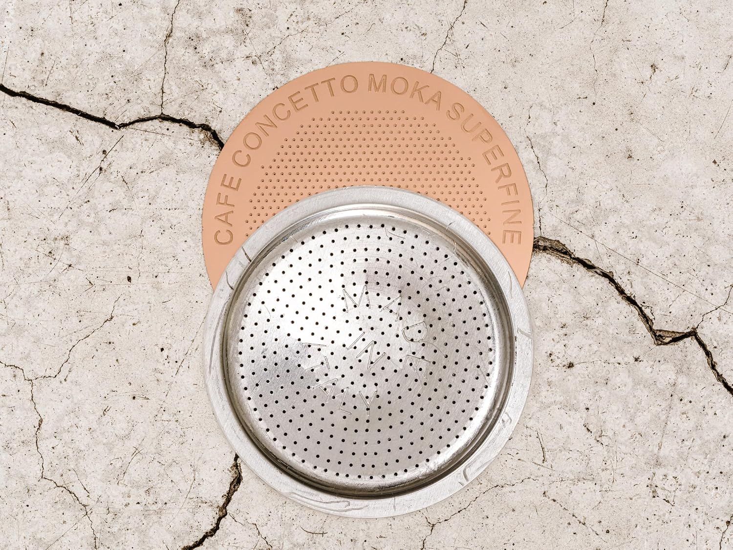 Cafe Concetto Superfine Moka Disc 57.5 mm with a moka pot filter basket