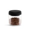 Fellow Atmos Vacuum Canister in clear glass with black vacuum lid, filled with coffee beans