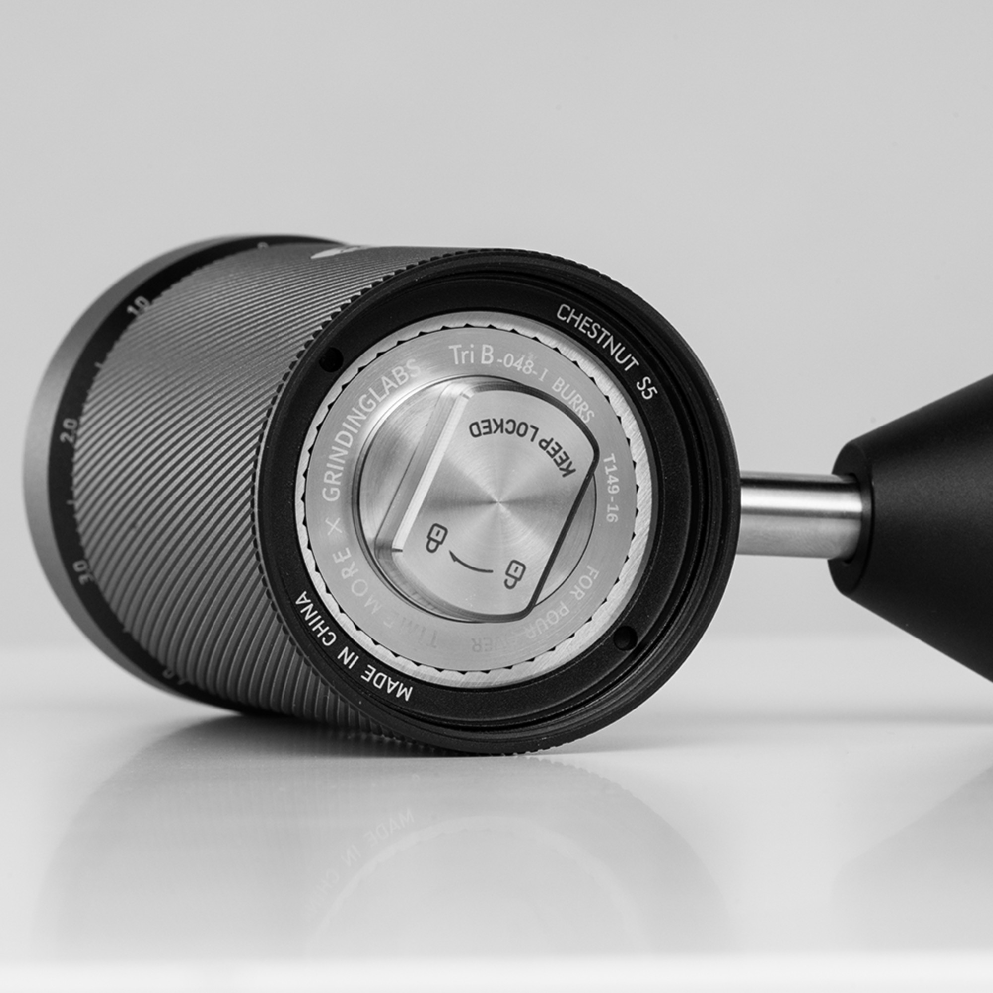 View into the bottom of the black Timemore S5 Pro body showing the burr assembly
